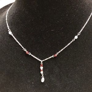 Vintage necklace with clear and deep ruby stones.